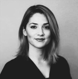 Black and white professional headshot of Kimberly Garza: Founder Principal, ATLAS Lab Inc. with shoulder-length hair